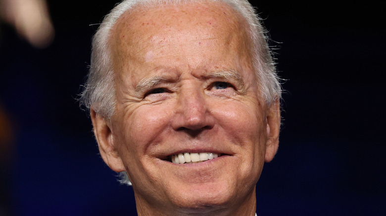 Joe Biden smiling onstage