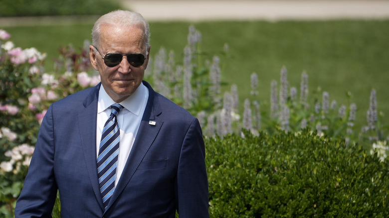 President Joe Biden smiling with sunglasses