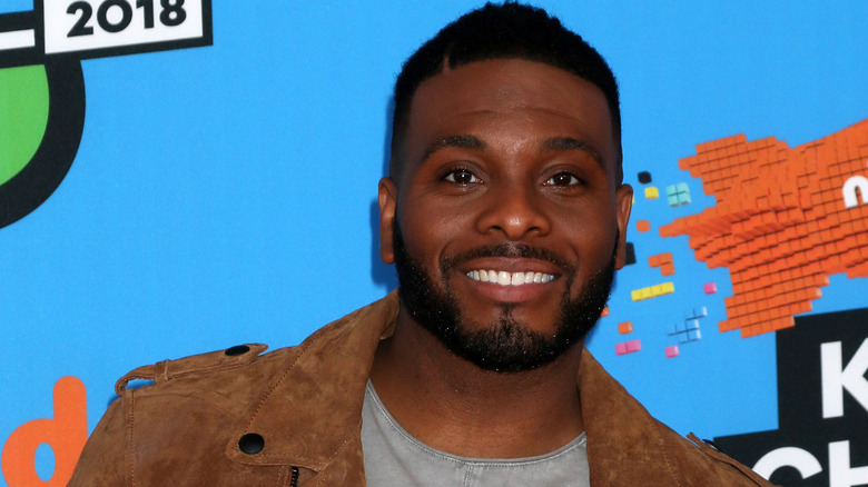 Kel Mitchell smiles at camera