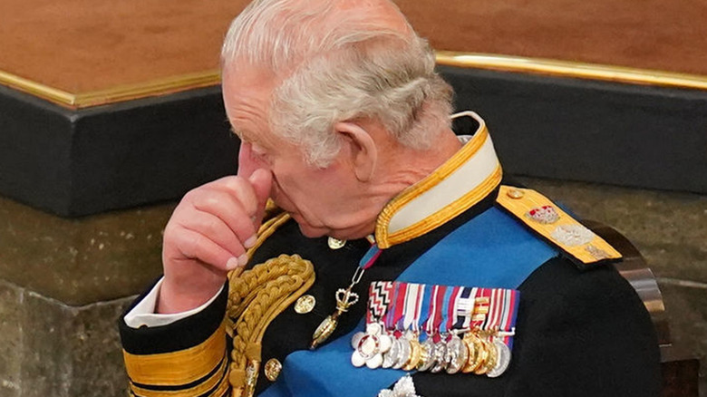 King Charles sheds tears