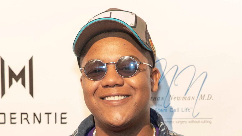 Kyle Massey smiling at camera at an event