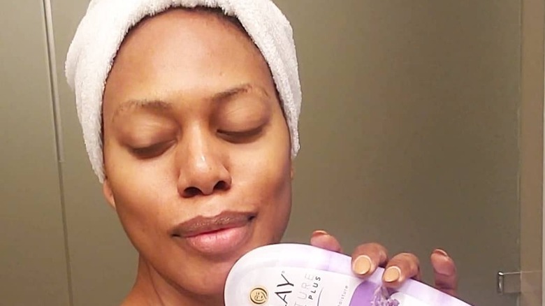 A fresh-faced Laverne Cox poses with an Olay product