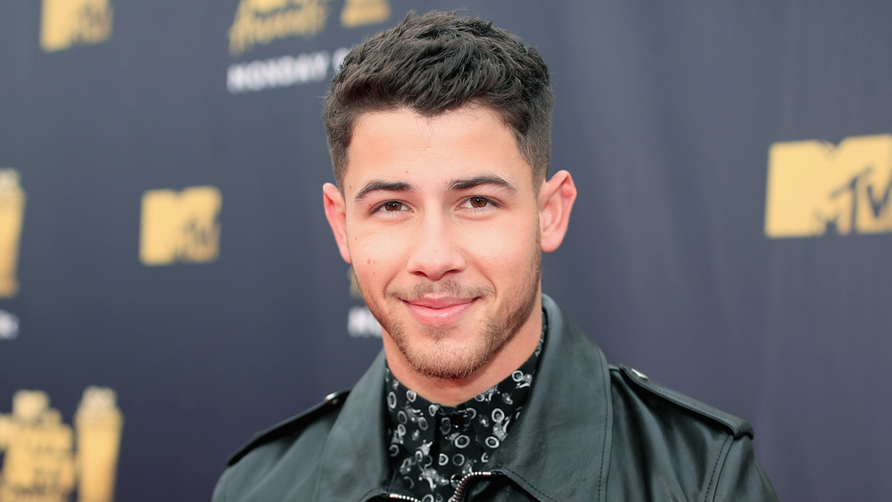 Nick Jonas smirk