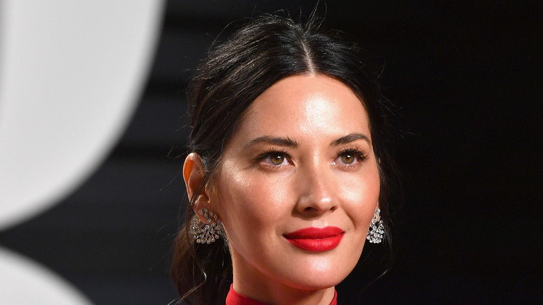 Olivia Munn poses at an event