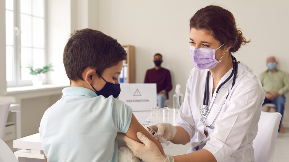 young boy getting vaccine