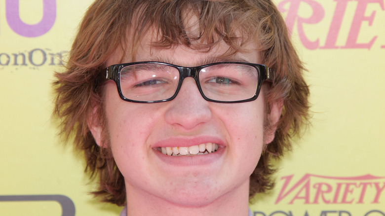 Angus T. Jones wearing glasses