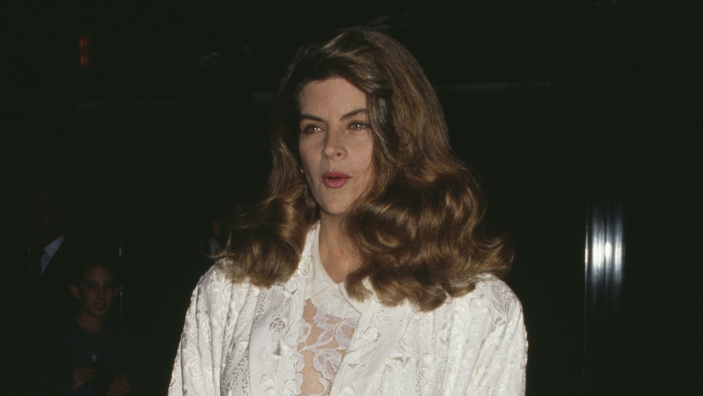 Kirstie Alley in a white outfit in 1990