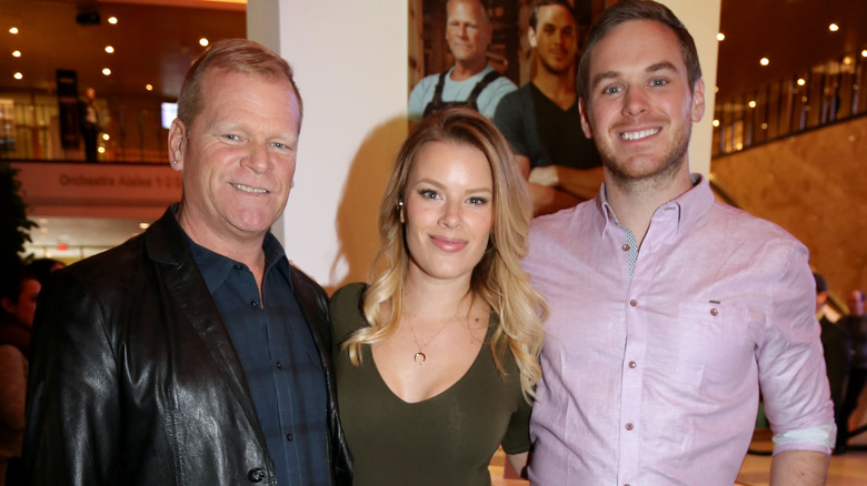 Mike Holmes posing with children