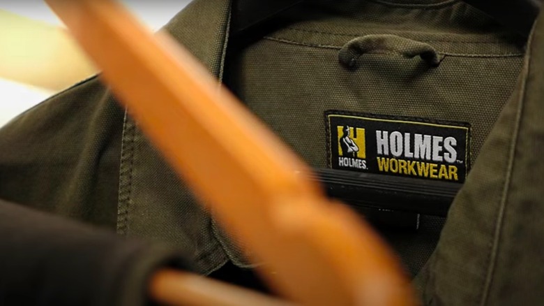 A Holmes Workwear tag on a shirt