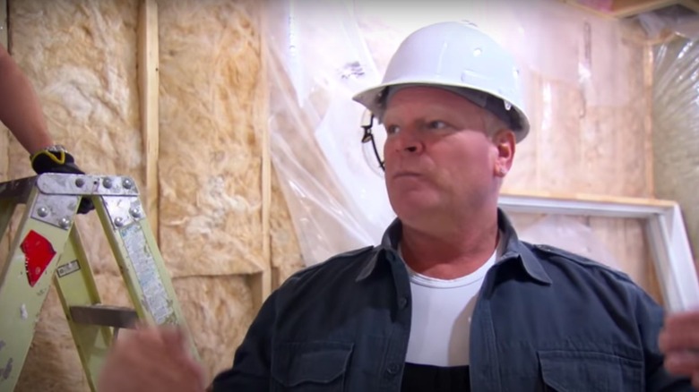 Mike Holmes wearing a hardhat