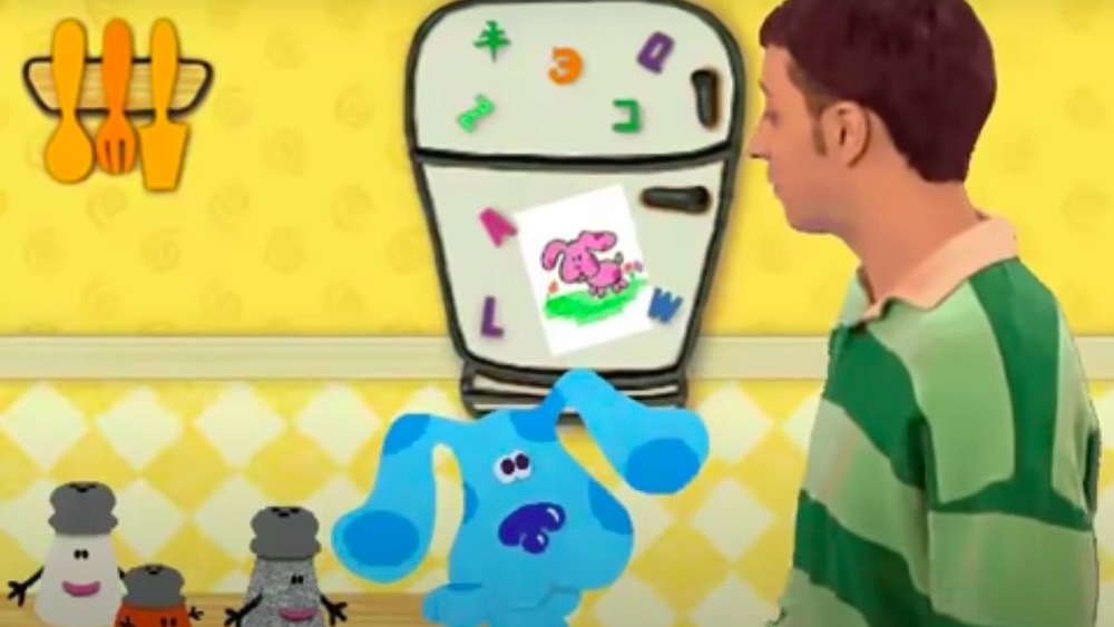 Steve Burns and Blue in a kitchen on Blue's Clues