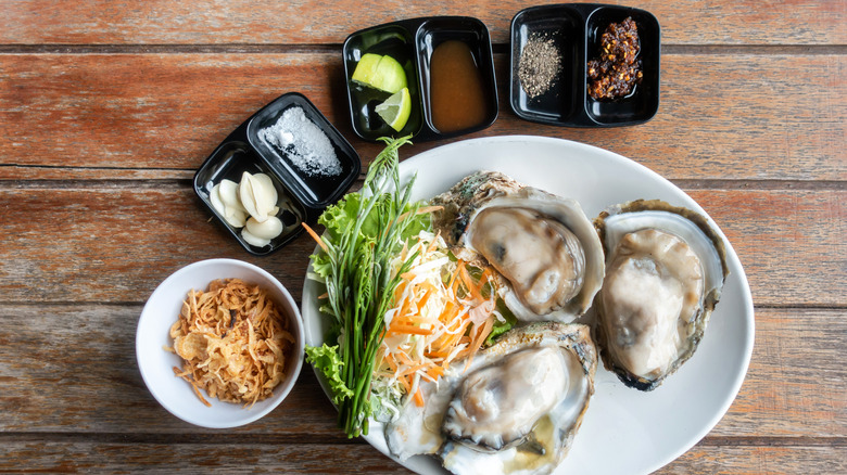 Oysters with sides and condiments