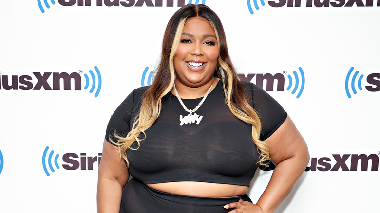 Lizzo wears Yitty while posing on red carpet