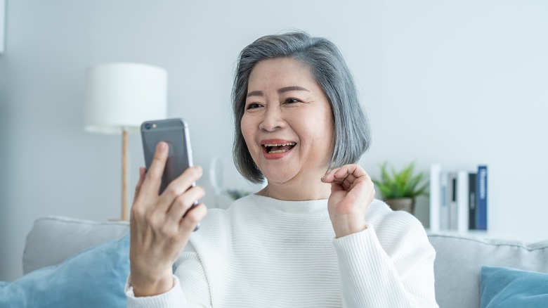 A woman looking at her phone. 