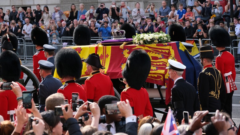 People watching the procession of the Queen's coffin