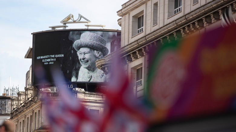 Billboard honoring Queen Elizabeth's life in Piccadilly Circus