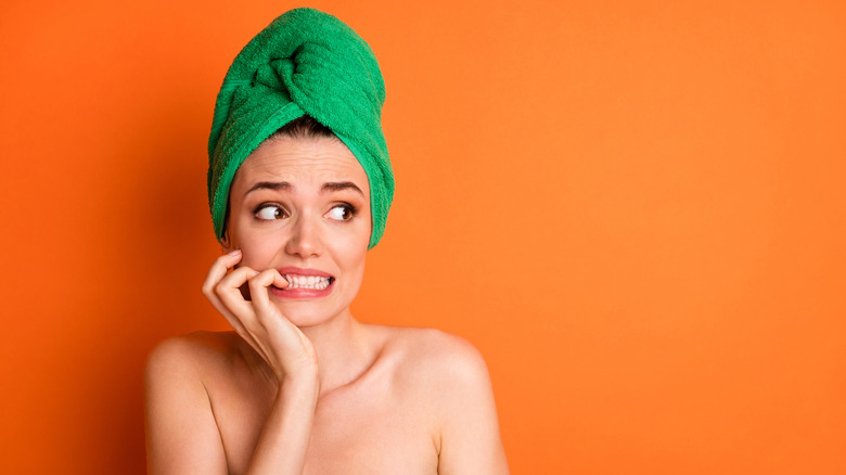 Woman in towel stressed