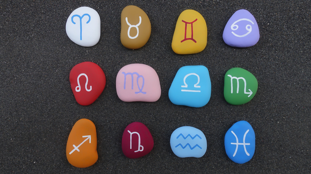 Zodiac signs on colored rocks