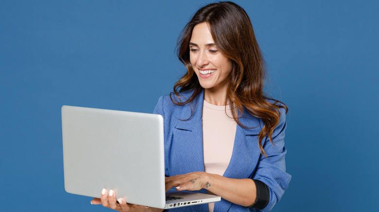 Person holding laptop