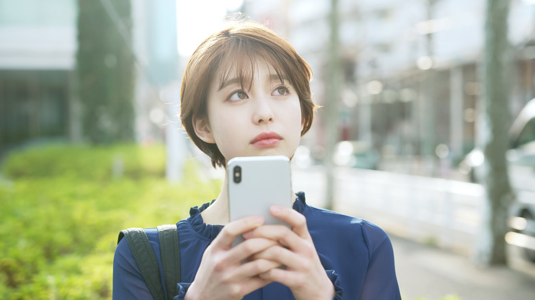 woman using smartphone outdoors