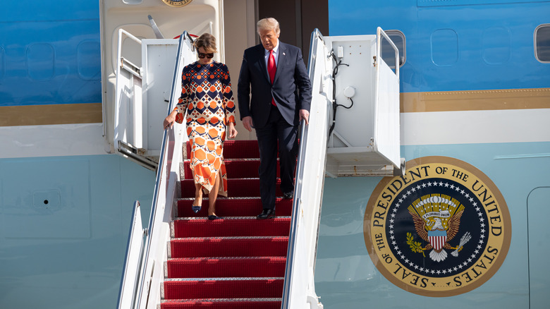 Donald Trump and Melania exit plane in Florida