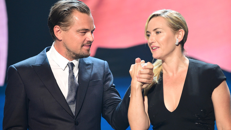 Kate Winslet and Leonardo DiCaprio holding hands