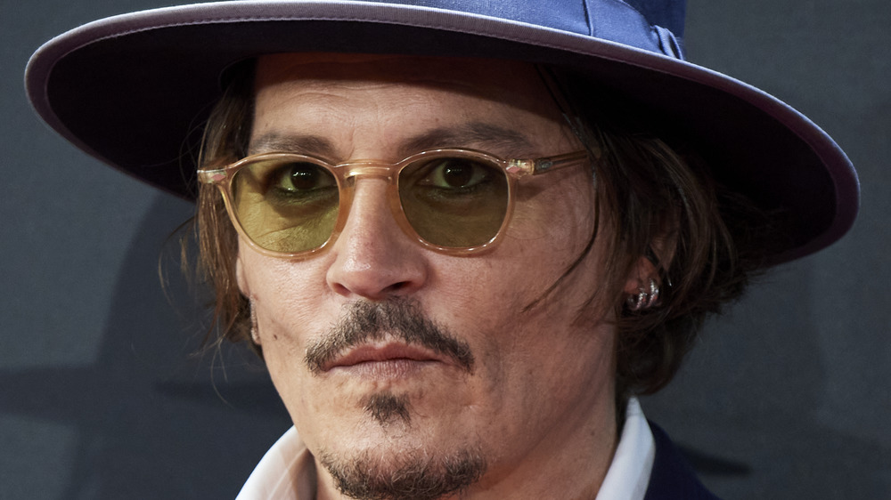 Johnny Depp wearing a blue hat