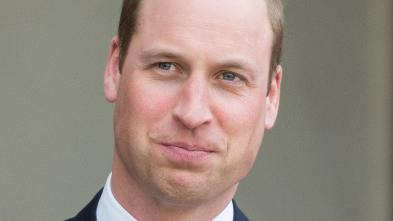 Prince William looking on