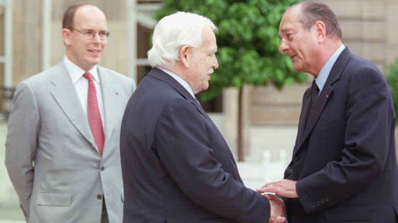 Prince Albert looking at Prince Rainier and Jacques Chirac 