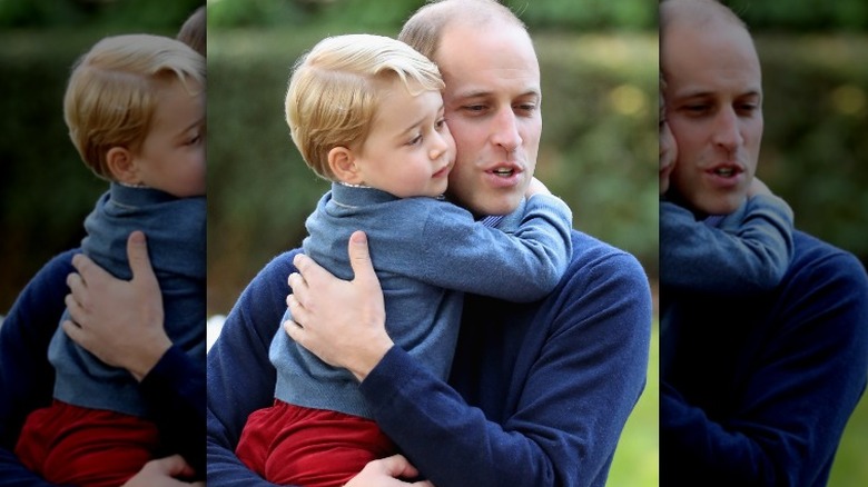 Prince William holding Prince George