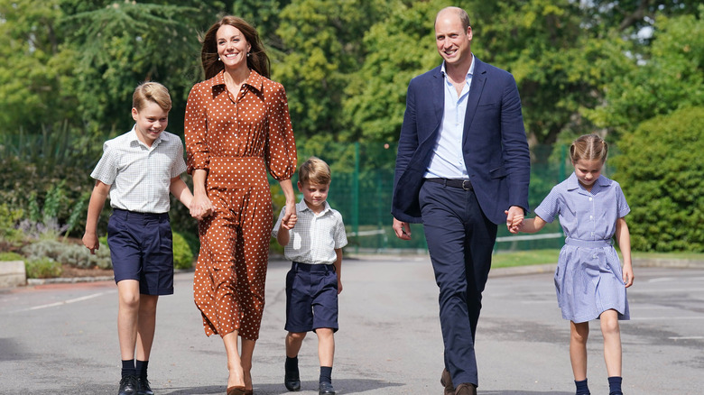 Prince William and Princess Catherine walking with kids