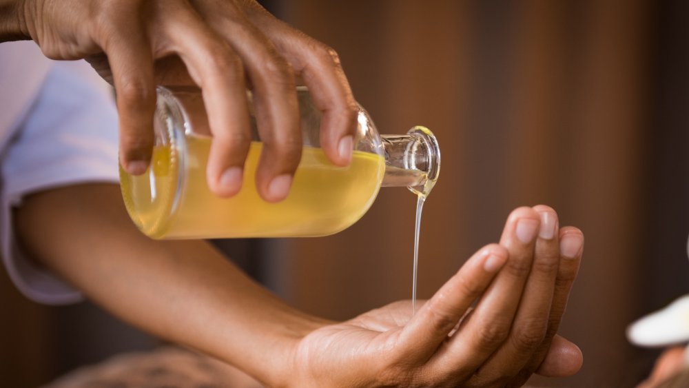 Adding oil to hair and scalp keeps marley twists smooth and soft