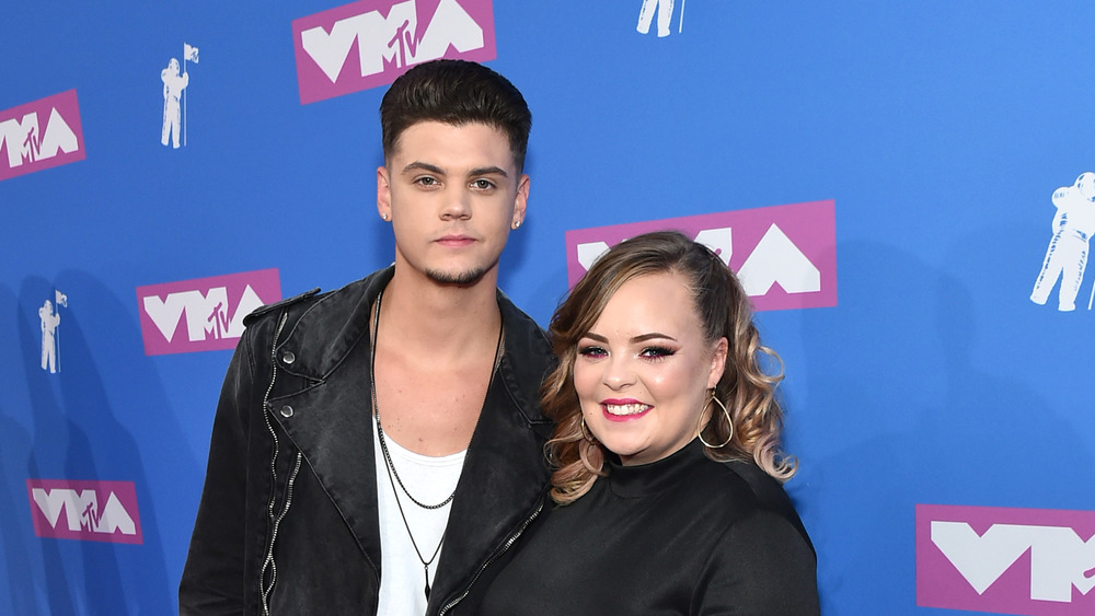 Teen Mom OG's Catelynn Lowell poses at an event with husband Tyler Baltierra