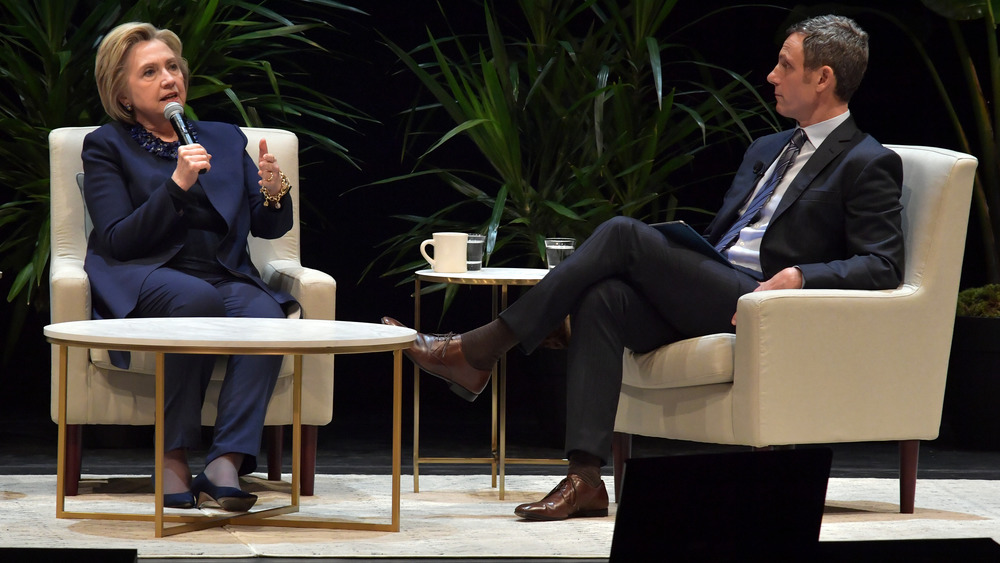 Tony Goldwyn and Hillary Clinton with microphones