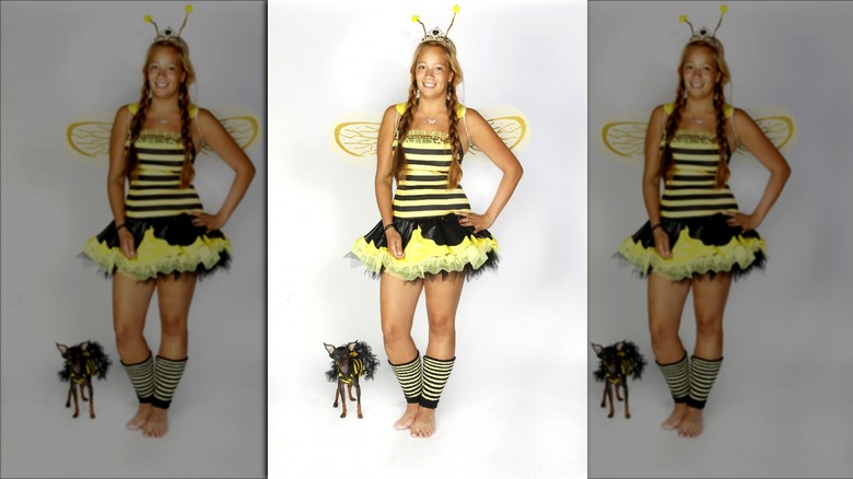 Woman and dog bee costumes