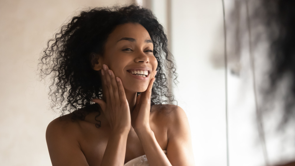 Girl with curly hair smiling