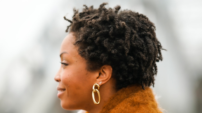 woman with multiple ear piercings