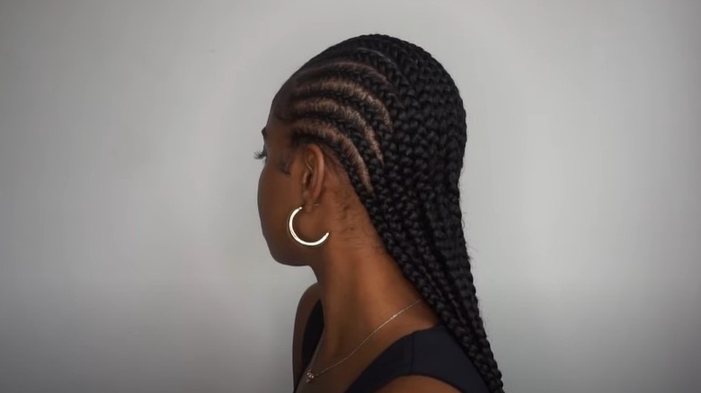 Black woman with cornrows