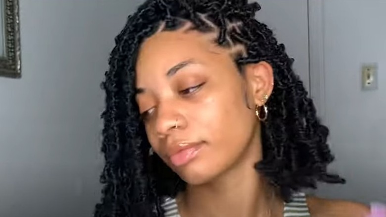 Black woman with short faux locs