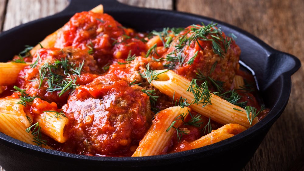 Pasta with tomato sauce in cast iron skillet