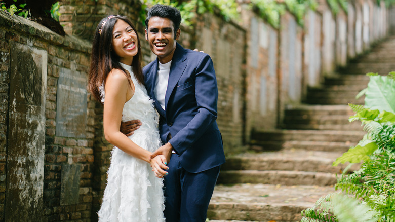 woman and man smiling and posing