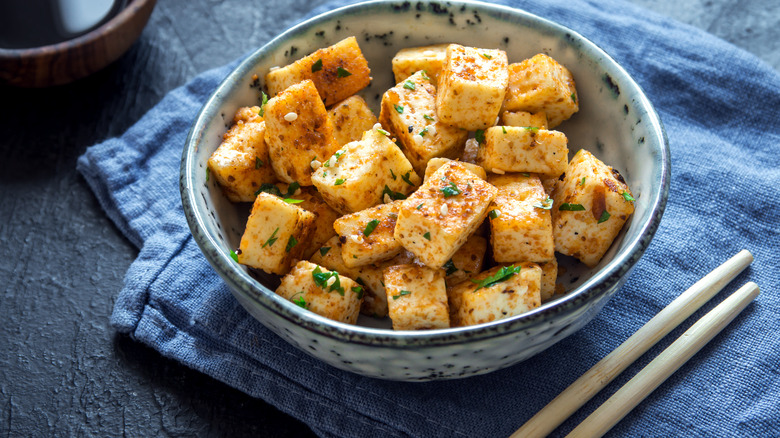 stir fried tofu with chopsticks