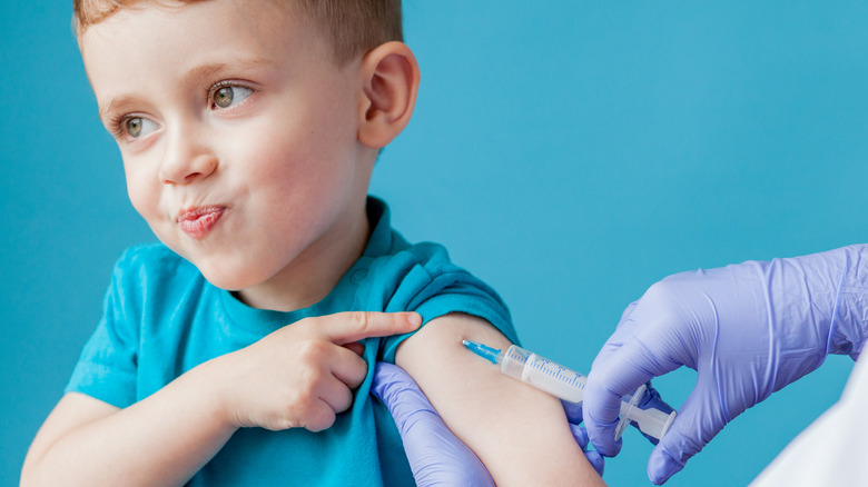 kid getting vaccine