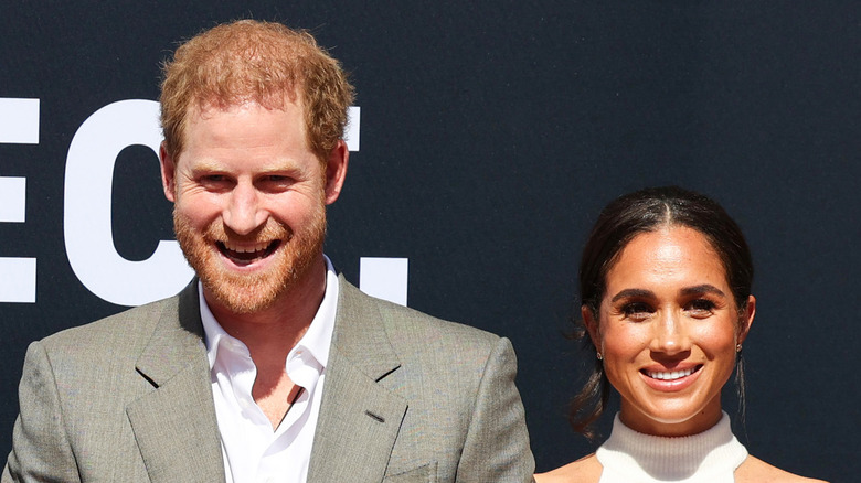 Prince Harry and Meghan Markle smiling in Germany