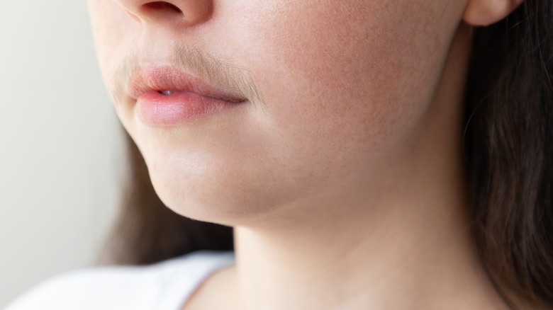 Woman with hair in upper lip