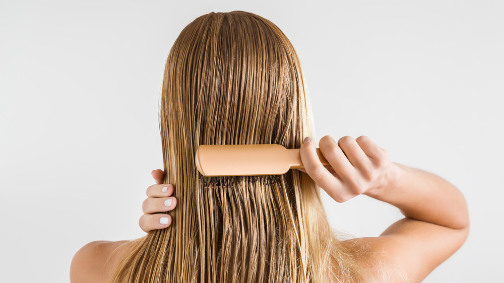 A woman brushing her hair