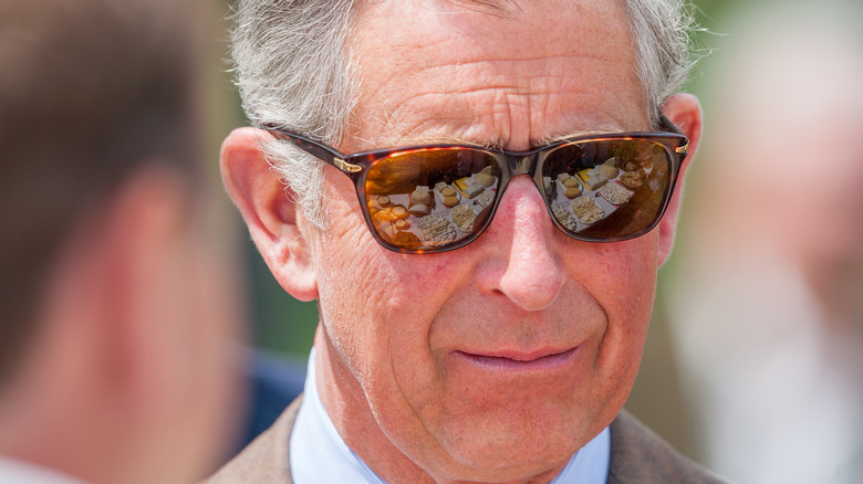 Prince Charles posing with sunglasses on