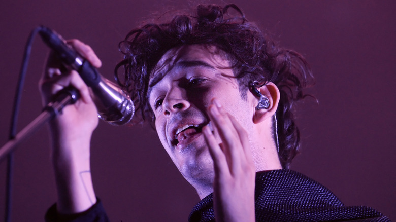 Matty Healy singing onstage