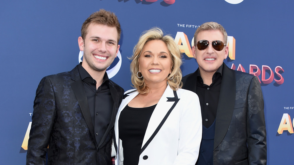 Chase, Julie and Todd Chrisley attend an event together