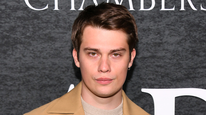 Nicholas Galitzine poses on the red carpet